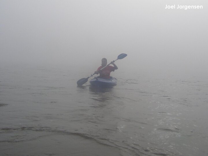 Lauren Dinan kayaking down the river in the mist
