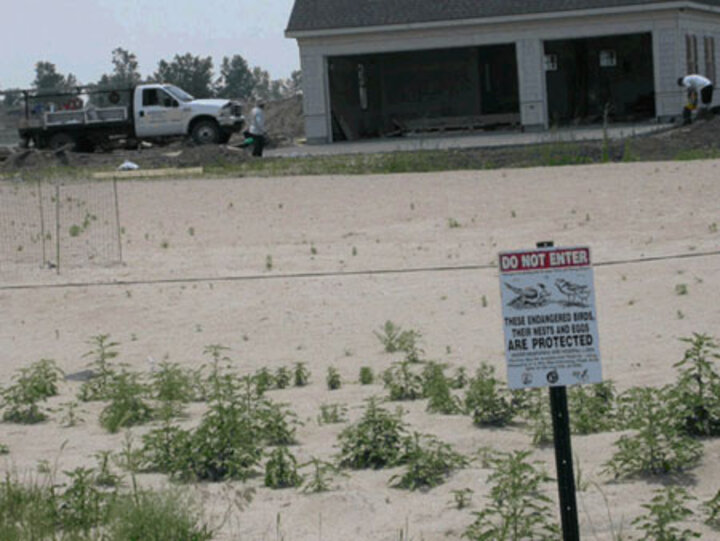 Housing Project with warning sign